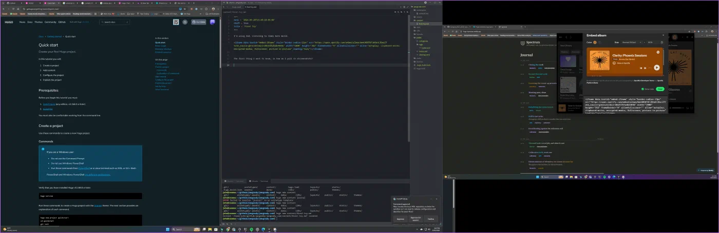 A wide multi-monitor desktop with the editor, a terminal and a browser tiled across the span.